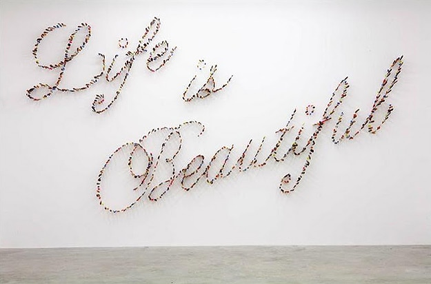 Life Is Beautiful: An Art Installation Created By Stabbing Knives Life Is Beautiful: An Art Installation Created By Stabbing Knives