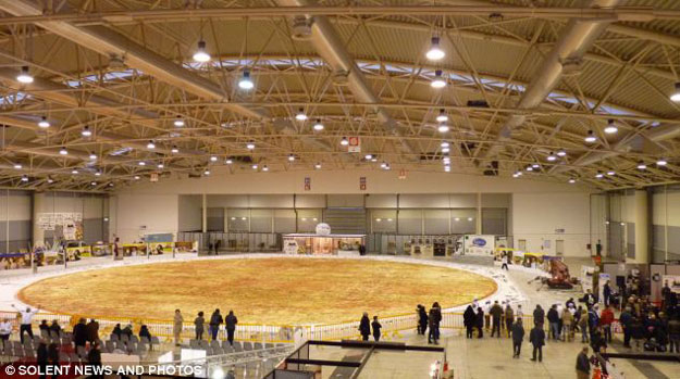 The World’s Largest Pizza (It Has 19,800 Pounds Of Cheese On It) The World’s Largest Pizza (It Has 19,800 Pounds Of Cheese On It)