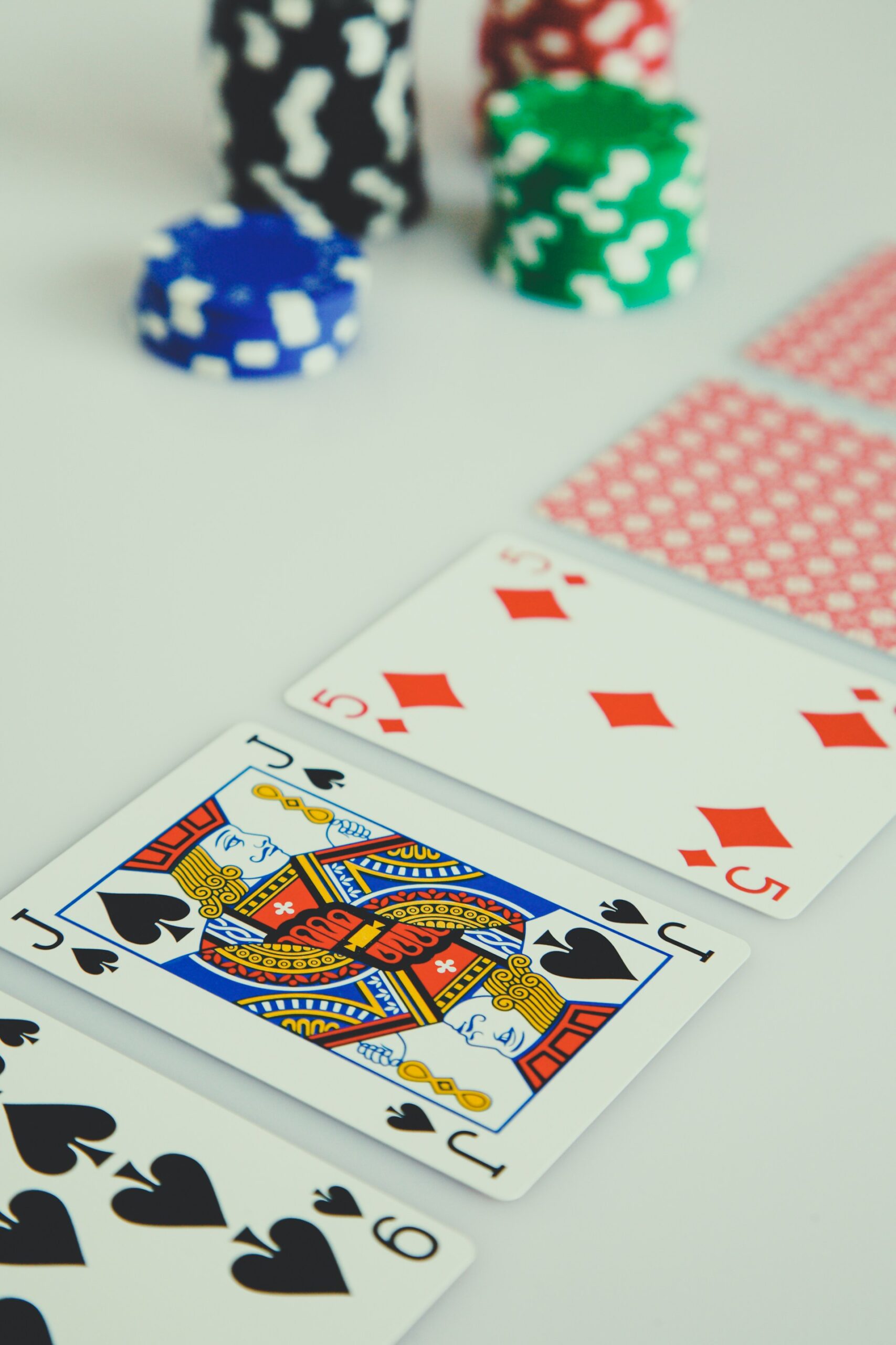 Assorted Playing Cards on White Surface