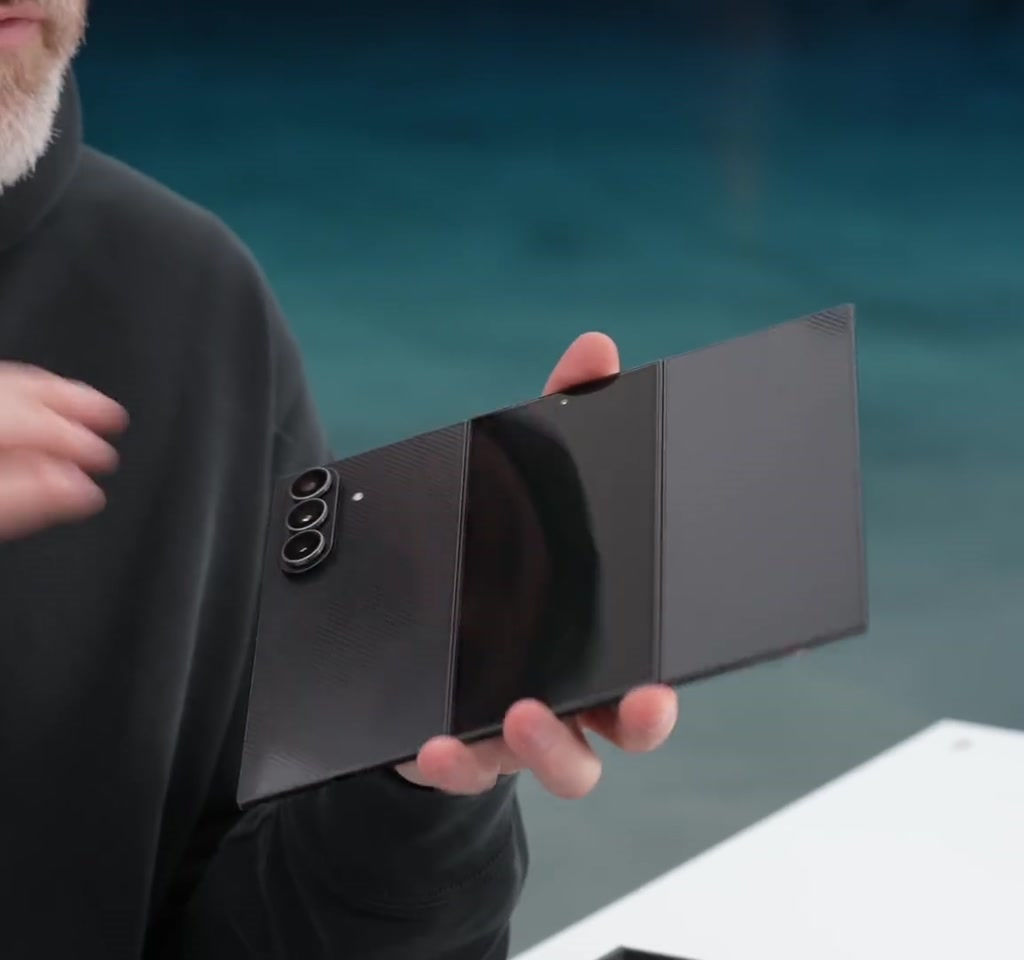 Samsung Galaxy Z Tri Fold opened into a 10-inch tablet showing the triple-hinge design and a subtle screen crease